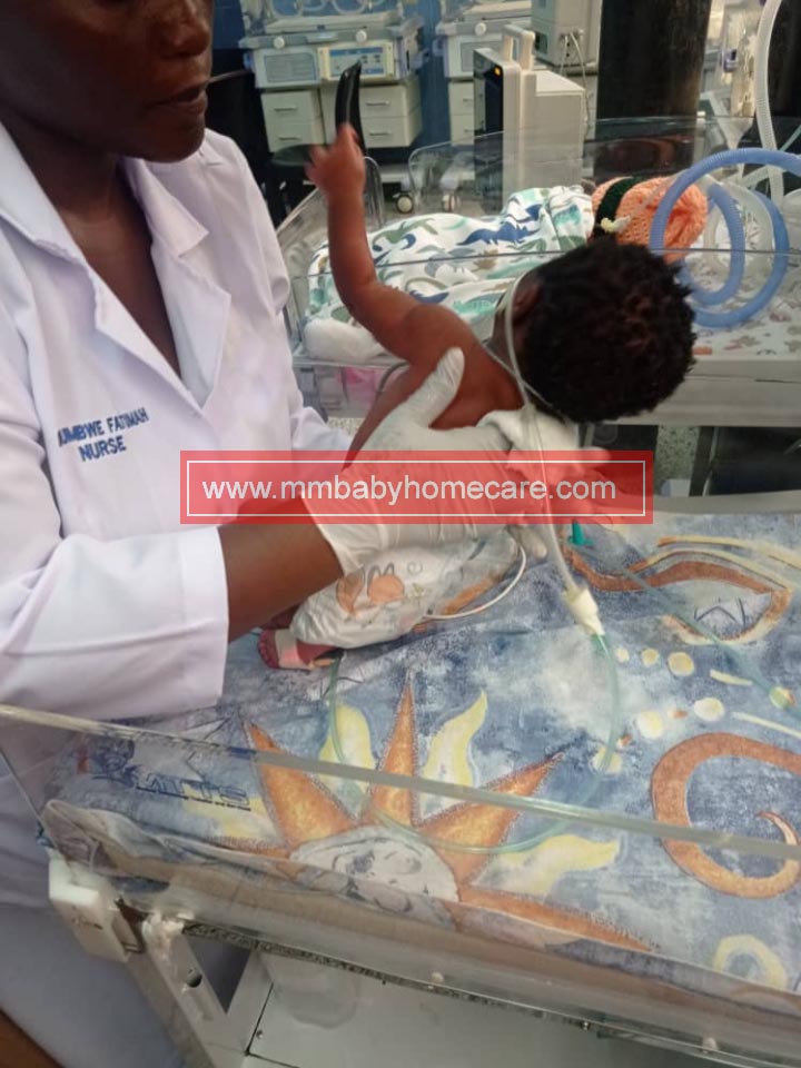 mmbabyhomecare nurse working on baby